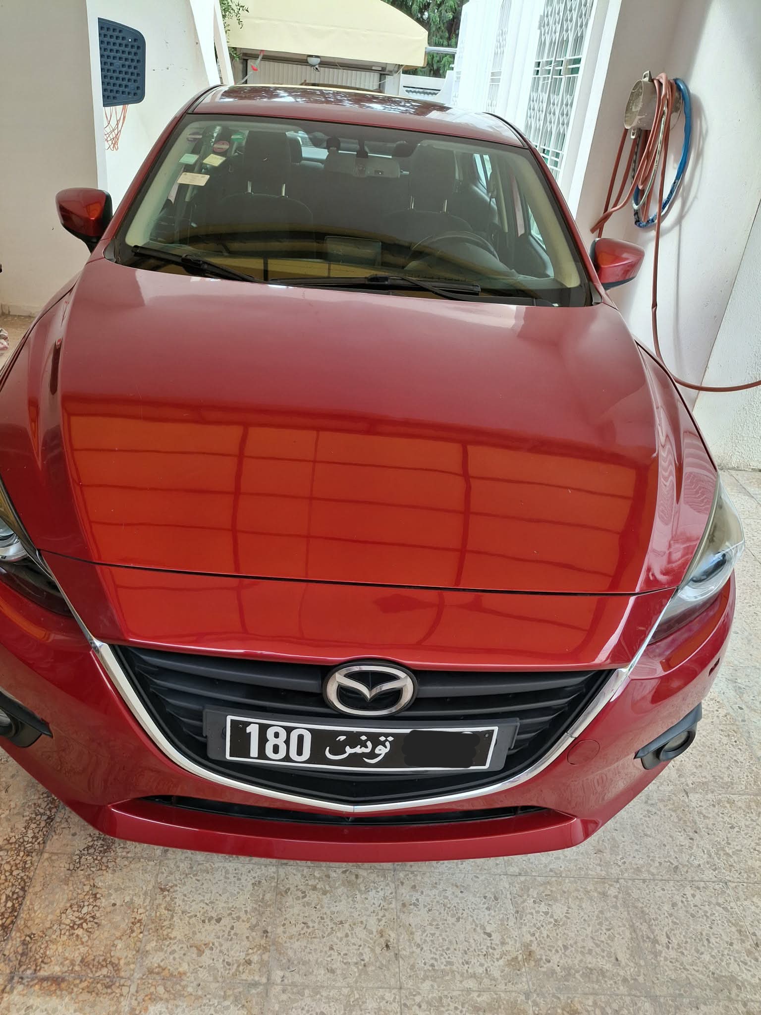 Bou Mhel El Bassatine&nbsp;Cite Plein Air&nbsp;Mazda&nbsp;3&nbsp;Mazda 3 berline rouge cristal